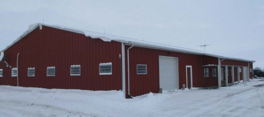 Building 1, red steel building with overhead door